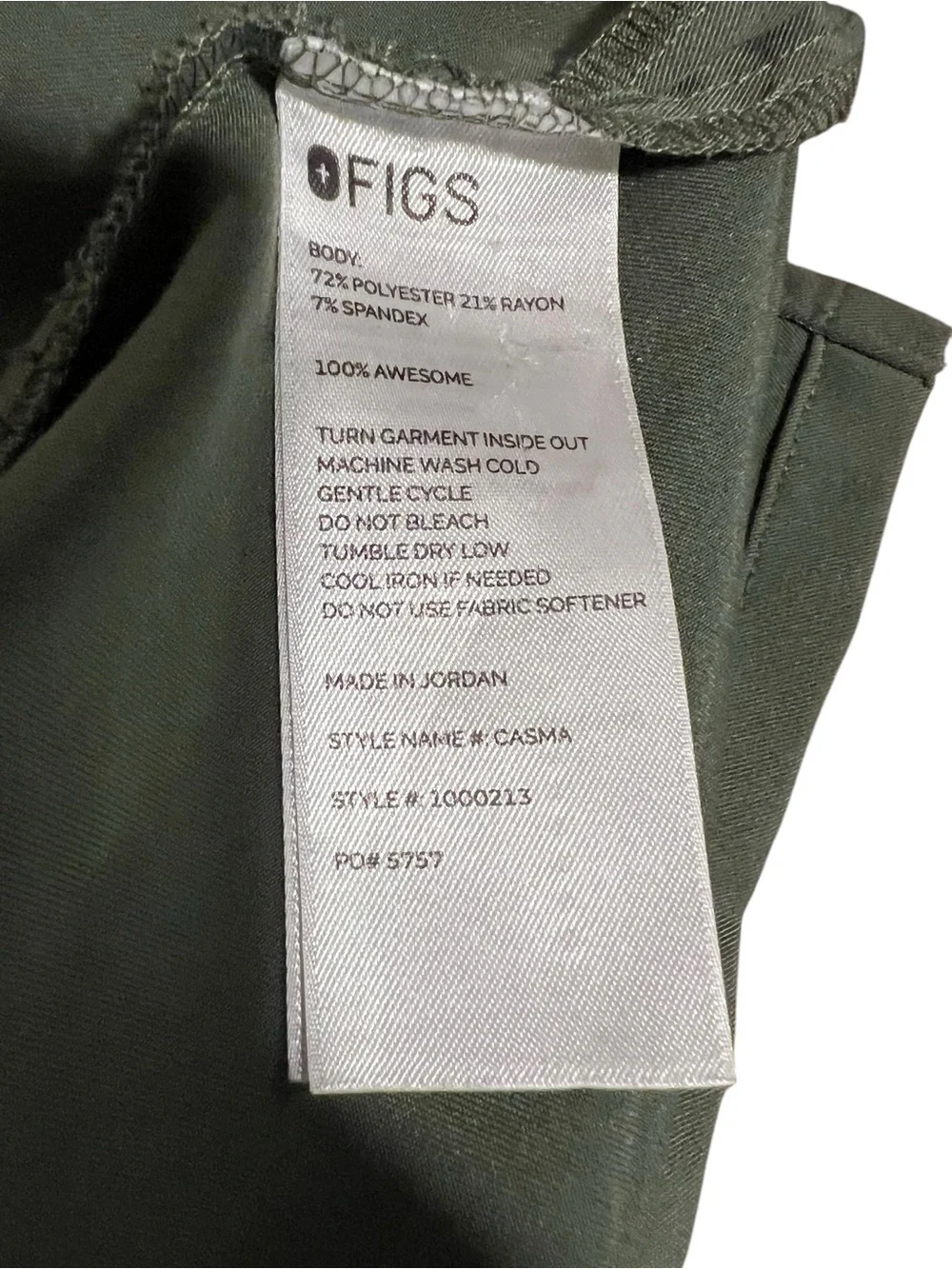 FIGS Casma three-pocket V-neck scrub top featuring a soft greyish-green.